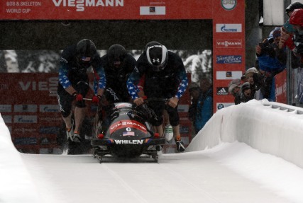 Former U.S. Army World Class Athlete Program bobsled driver Steven Holcomb (right) teams with Curtis Tomasevicz, Steven Langton and WCAP brakeman Capt. Christopher Fogt to win the four-man bobsled event at the International Bobsled & Skeleton Federation's 2013 World Cup stop Dec. 7 at Utah Olympic Park in Park City, Utah. Holcomb, the reigning Olympic four-man champion driver who spent seven years in the U.S. Army World Class Athlete Program, is 4-0 this World Cup season with two-man and four-man victories at Calgary, Canada, and Park City. U.S. Army photo by Tim Hipps, IMCOM Public Affairs