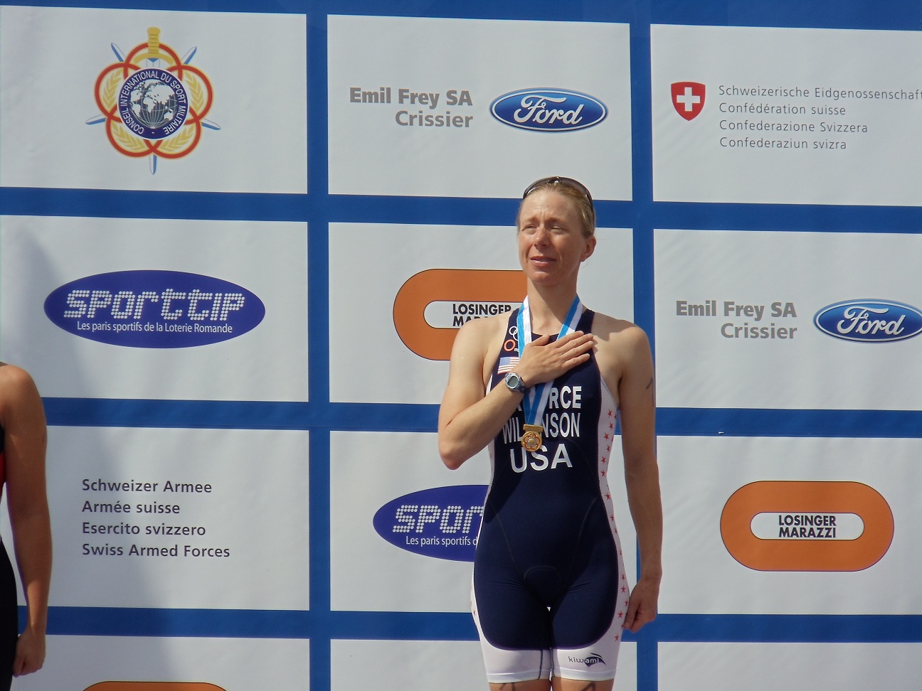 SSgt Jolene Wilkinson at top of the podium after receiving the golf medal in the 2012 CISM Triathlon Veterans Womens Division